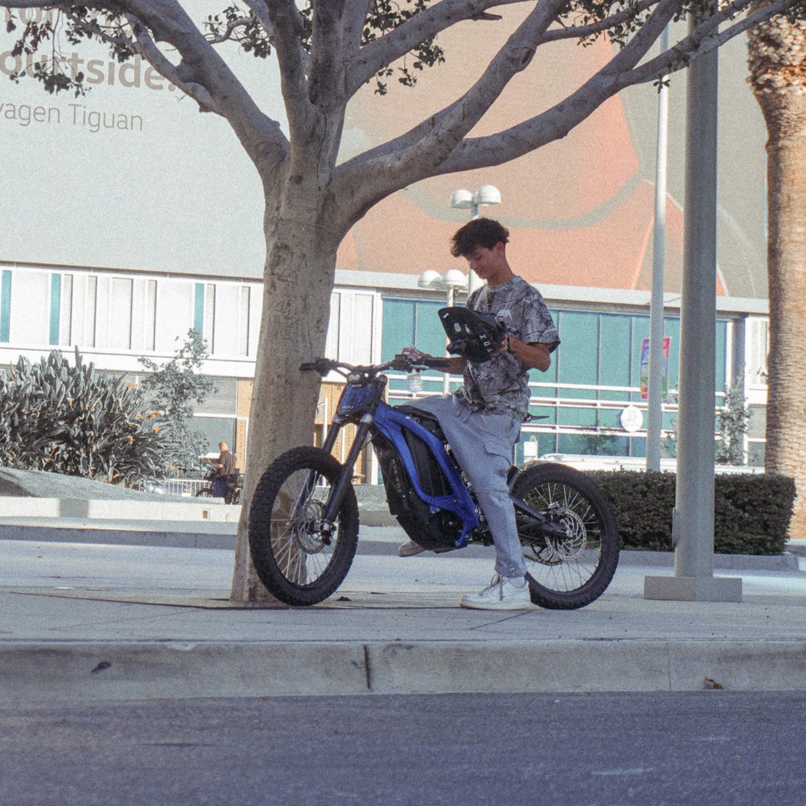 person riding blue surron